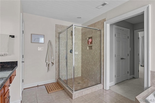 14136 Rigney Dr, Midlothian, VA 23113 - bathroom with vanity, a shower stall, baseboards, and tile patterned floors