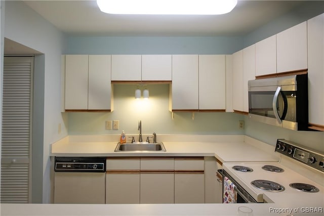 54 Villa Ridge Dr Unit C, Hartfield, VA 23071 - kitchen featuring white electric range oven, stainless steel microwave, dishwasher, a sink, and white cabinetry