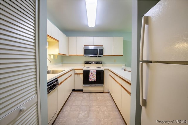 54 Villa Ridge Dr Unit C, Hartfield, VA 23071 - kitchen featuring white appliances, a sink, light countertops, and white cabinets