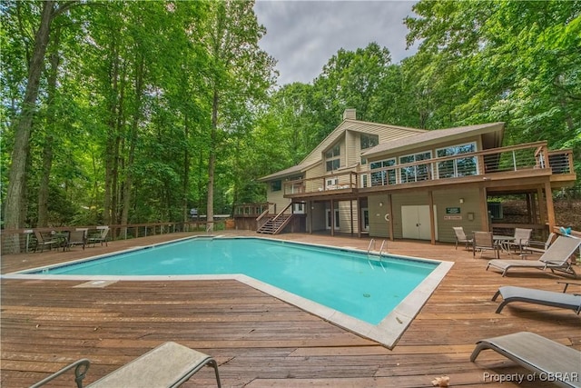 54 Villa Ridge Dr Unit C, Hartfield, VA 23071 - swimming pool with a wooden deck and stairs