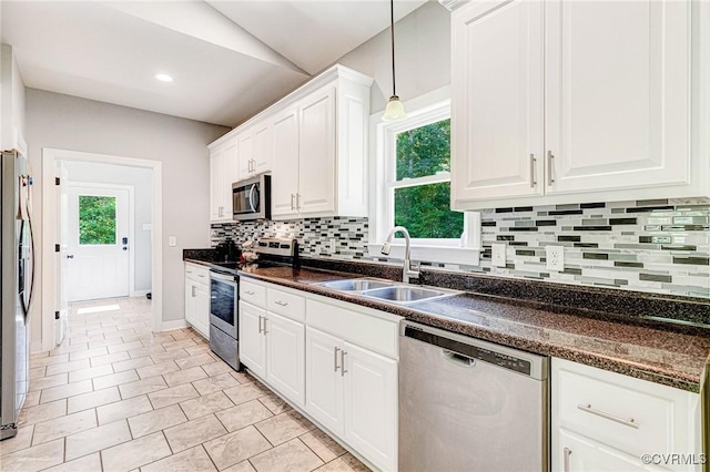 6180 Emmaus Church Rd, Providence Forge, VA 23140 - kitchen with appliances with stainless steel finishes, a sink, dark countertops, white cabinetry, and tasteful backsplash