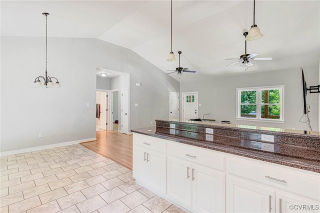 6180 Emmaus Church Rd, Providence Forge, VA 23140 - kitchen with vaulted ceiling, ceiling fan, pendant lighting, a chandelier, and white cabinetry