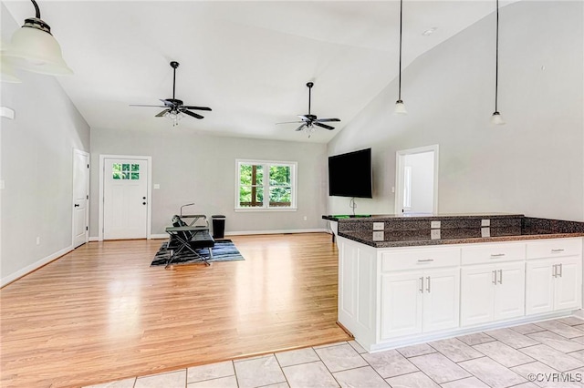 6180 Emmaus Church Rd, Providence Forge, VA 23140 - kitchen featuring a ceiling fan, open floor plan, white cabinetry, decorative light fixtures, and high vaulted ceiling