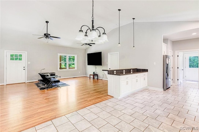 6180 Emmaus Church Rd, Providence Forge, VA 23140 - living room with vaulted ceiling, healthy amount of natural light, ceiling fan, baseboards, and light wood-style floors