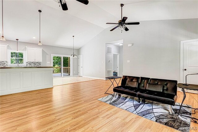 6180 Emmaus Church Rd, Providence Forge, VA 23140 - living area with a ceiling fan, lofted ceiling, light wood-type flooring, and baseboards