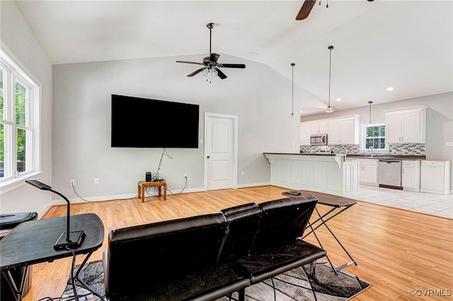 6180 Emmaus Church Rd, Providence Forge, VA 23140 - living room featuring a ceiling fan, vaulted ceiling, light wood-type flooring, and baseboards