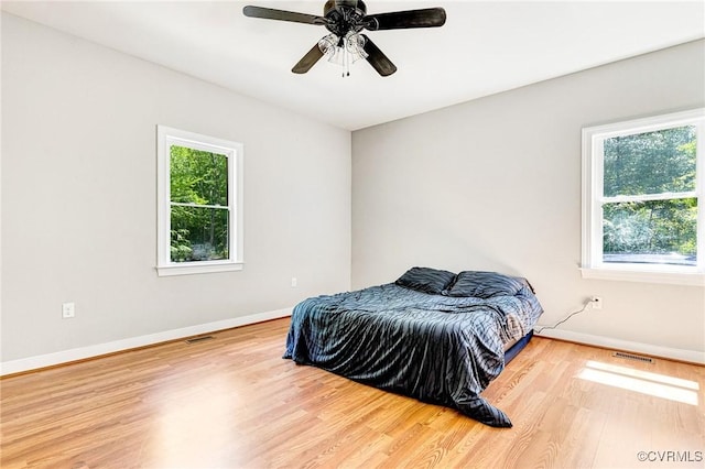 6180 Emmaus Church Rd, Providence Forge, VA 23140 - bedroom featuring multiple windows, wood finished floors, and baseboards