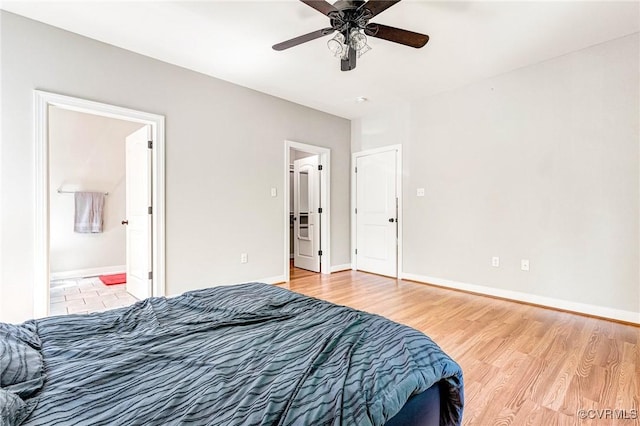 6180 Emmaus Church Rd, Providence Forge, VA 23140 - bedroom featuring wood finished floors, baseboards, ceiling fan, and connected bathroom