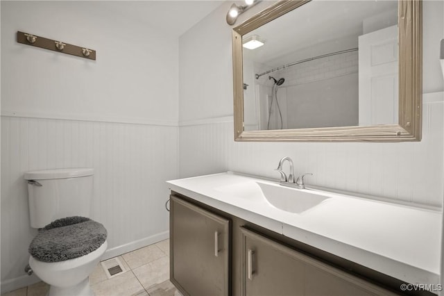 9901 Husting Ct, Chesterfield, VA 23832 - bathroom featuring vanity, toilet, wainscoting, a shower, and tile patterned flooring