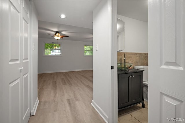 9901 Husting Ct, Chesterfield, VA 23832 - hall with a sink, light wood-style floors, recessed lighting, and baseboards