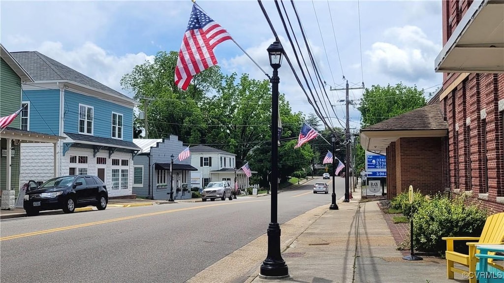 1992 Town Bridge Rd, Urbanna, VA 23175 - view of asphalt street with sidewalks, curbs, and street lighting