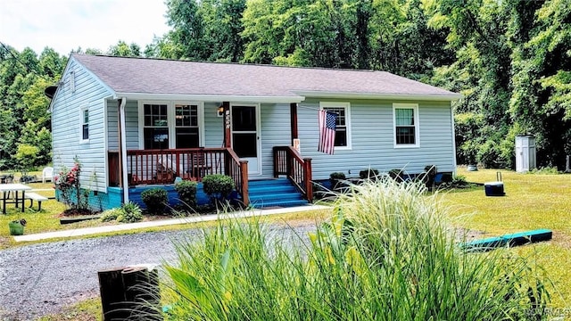 1992 Town Bridge Rd, Urbanna, VA 23175 - view of front of house featuring a porch and a front yard
