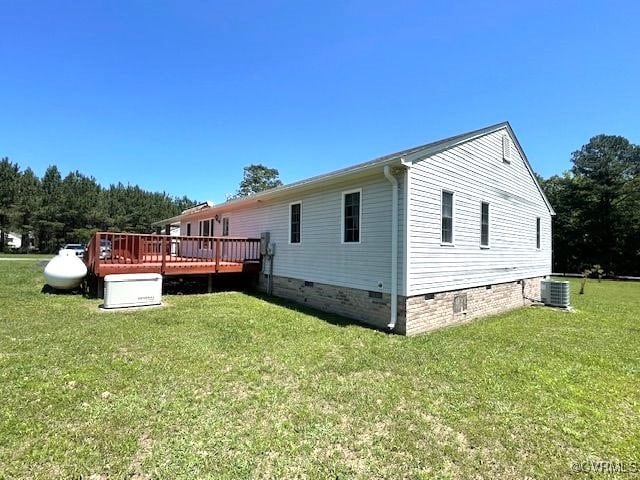 22290 Butterwood Rd, Dinwiddie, VA 23803 - rear view of house featuring crawl space, a wooden deck, a yard, and cooling unit