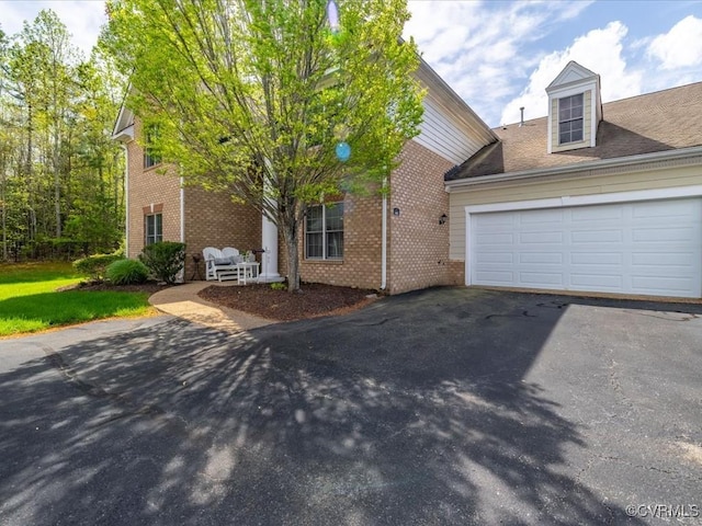 442 Dunlin Ct, Midlothian, VA 23114 - view of front of property with driveway, brick siding, and an attached garage