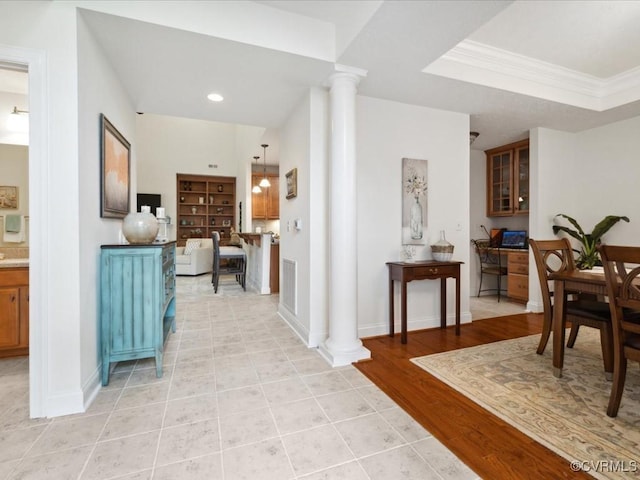 442 Dunlin Ct, Midlothian, VA 23114 - hallway with ornate columns, baseboards, a desk, ornamental molding, and light wood-type flooring