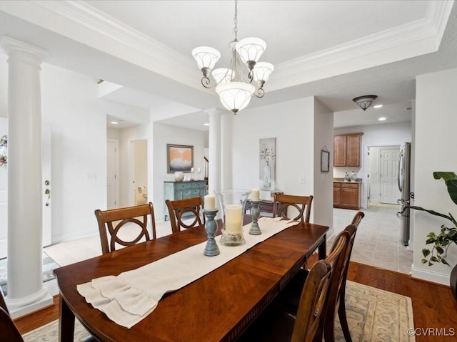 442 Dunlin Ct, Midlothian, VA 23114 - dining room featuring ornate columns, crown molding, recessed lighting, light wood-style floors, and a chandelier