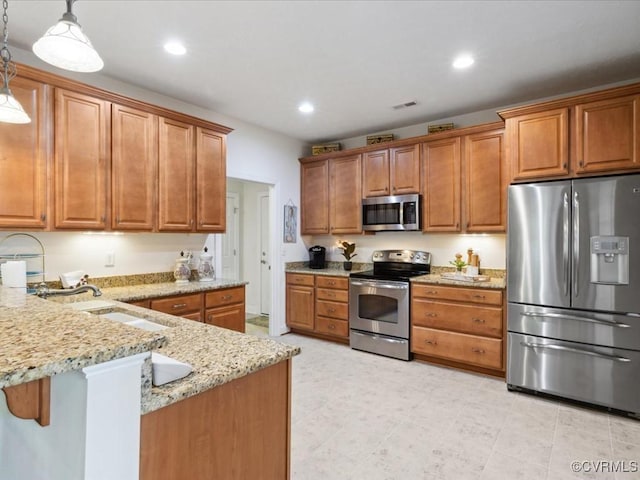 442 Dunlin Ct, Midlothian, VA 23114 - kitchen with stainless steel appliances, light stone counters, a peninsula, pendant lighting, and a sink