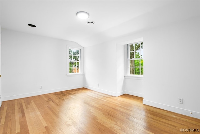 13531 W Salisbury Rd, Midlothian, VA 23113 - empty room featuring vaulted ceiling, light wood-type flooring, plenty of natural light, and baseboards