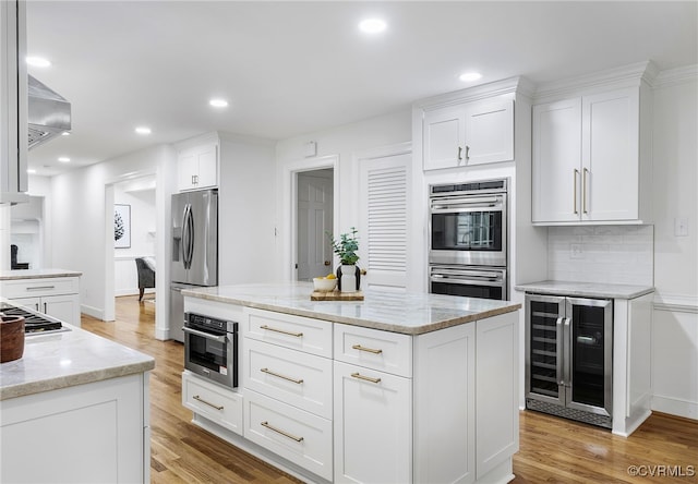 13531 W Salisbury Rd, Midlothian, VA 23113 - kitchen with beverage cooler, appliances with stainless steel finishes, white cabinets, light wood-style flooring, and recessed lighting
