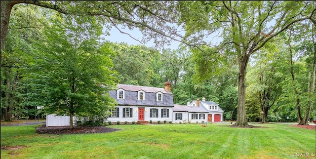 13531 W Salisbury Rd, Midlothian, VA 23113 - colonial inspired home with a gambrel roof, a chimney, and a front lawn