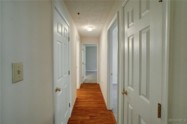 10205 Wolfe Manor Ct Unit 1012, Glen Allen, VA 23060 - corridor with a textured ceiling, baseboards, and wood finished floors