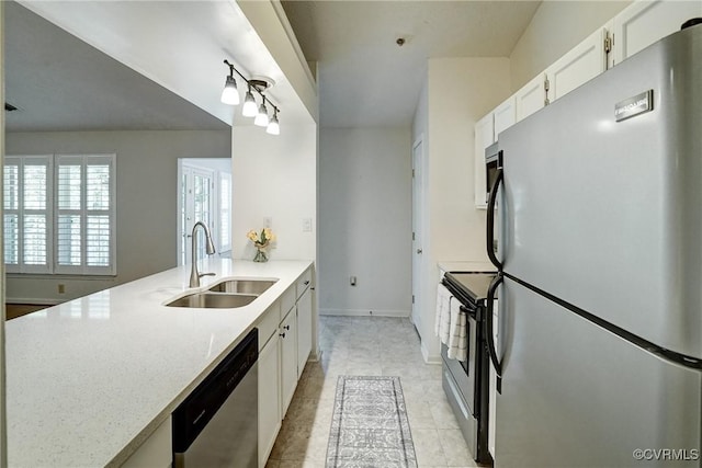 10205 Wolfe Manor Ct Unit 1012, Glen Allen, VA 23060 - kitchen with appliances with stainless steel finishes, a sink, white cabinets, light stone counters, and a peninsula