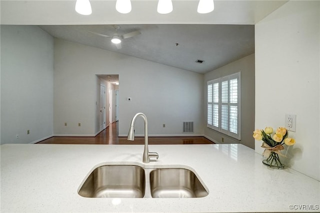 10205 Wolfe Manor Ct Unit 1012, Glen Allen, VA 23060 - kitchen featuring a sink, vaulted ceiling, light countertops, and wood finished floors