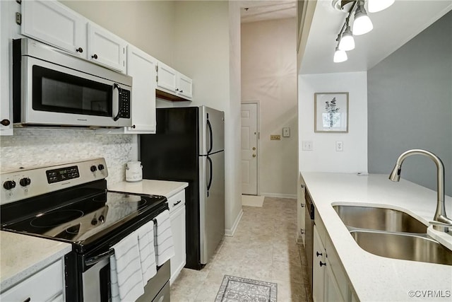 10205 Wolfe Manor Ct Unit 1012, Glen Allen, VA 23060 - kitchen featuring stainless steel appliances, a sink, white cabinetry, light countertops, and tasteful backsplash