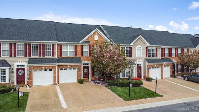 6049 Eagles Crest Dr, Chesterfield, VA 23832 - townhome / multi-family property featuring driveway, an attached garage, brick siding, and a front yard