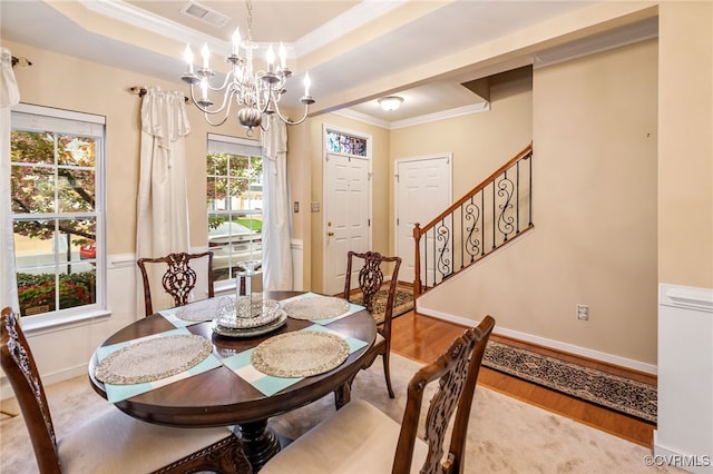 6049 Eagles Crest Dr, Chesterfield, VA 23832 - dining area with wood finished floors, ornamental molding, a chandelier, stairs, and baseboards