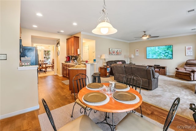 6049 Eagles Crest Dr, Chesterfield, VA 23832 - dining area featuring ceiling fan, baseboards, ornamental molding, recessed lighting, and light wood-style floors