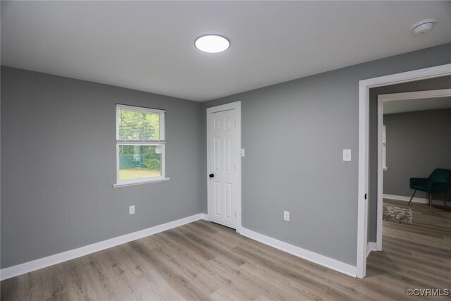 935 Wilcox St, Petersburg, VA 23803 - unfurnished bedroom featuring wood finished floors, baseboards, and a closet