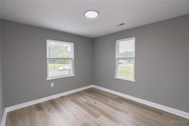 935 Wilcox St, Petersburg, VA 23803 - empty room with wood finished floors and baseboards