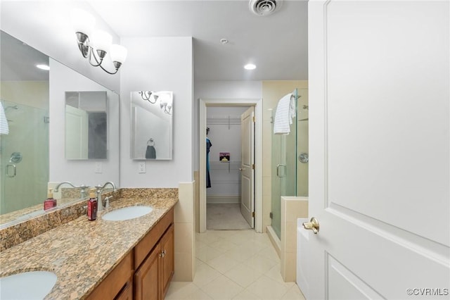 6 N 6th St Unit U2B, Richmond, VA 23219 - full bathroom featuring tile patterned floors, a stall shower, a walk in closet, double vanity, and recessed lighting