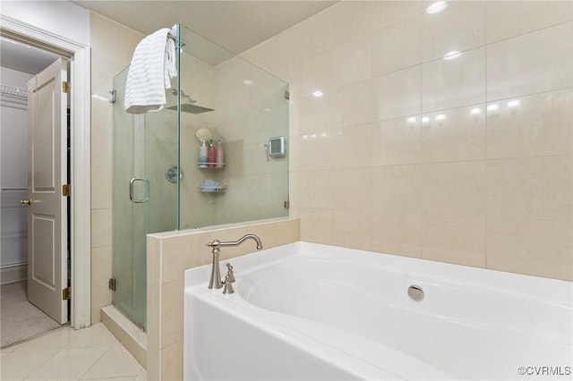 6 N 6th St Unit U2B, Richmond, VA 23219 - full bath featuring a shower stall, a garden tub, and tile patterned flooring