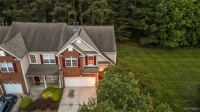 1753 Rose Mill Cir, Midlothian, VA 23112 - view of front of home with concrete driveway, a garage, a front yard, brick siding, and roof with shingles