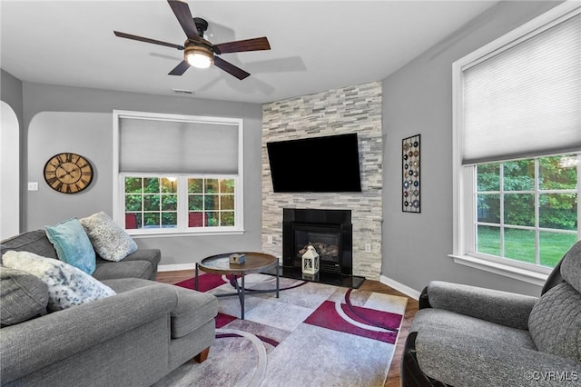 1753 Rose Mill Cir, Midlothian, VA 23112 - living room with wood finished floors, a ceiling fan, baseboards, and a fireplace