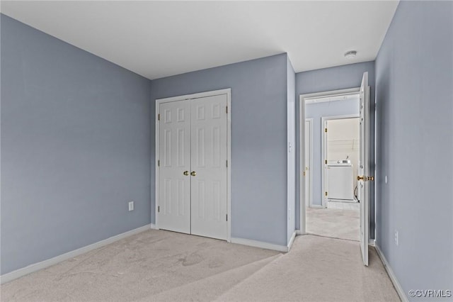 1753 Rose Mill Cir, Midlothian, VA 23112 - unfurnished bedroom featuring light carpet, washer / dryer, baseboards, and a closet