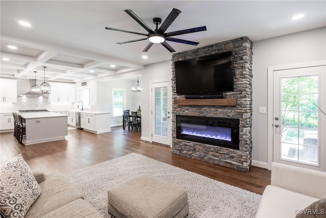 14104 Waters Edge Cir, Midlothian, VA 23112 - living area featuring dark wood-style flooring, a chandelier, recessed lighting, a stone fireplace, and beam ceiling