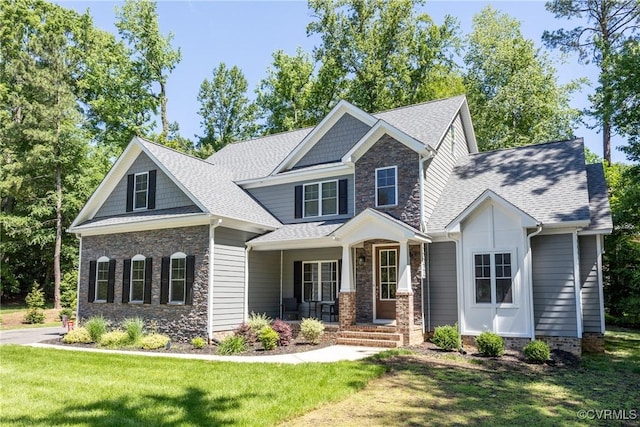 14104 Waters Edge Cir, Midlothian, VA 23112 - craftsman house featuring stone siding, a porch, a front lawn, and roof with shingles
