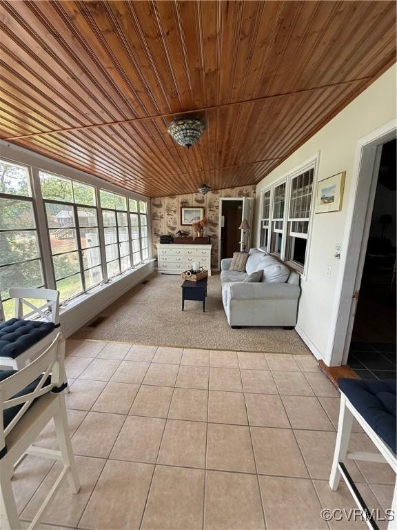 1686 Locust Grove Rd, Topping, VA 23169 - sunroom / solarium featuring wood ceiling, tile patterned floors, and carpet