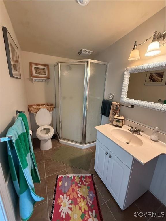 1686 Locust Grove Rd, Topping, VA 23169 - bathroom featuring vanity, a shower stall, tile patterned floors, and toilet