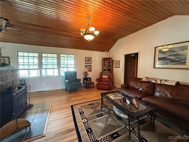 1686 Locust Grove Rd, Topping, VA 23169 - living area featuring lofted ceiling, wood finished floors, wooden ceiling, baseboards, and a tiled fireplace