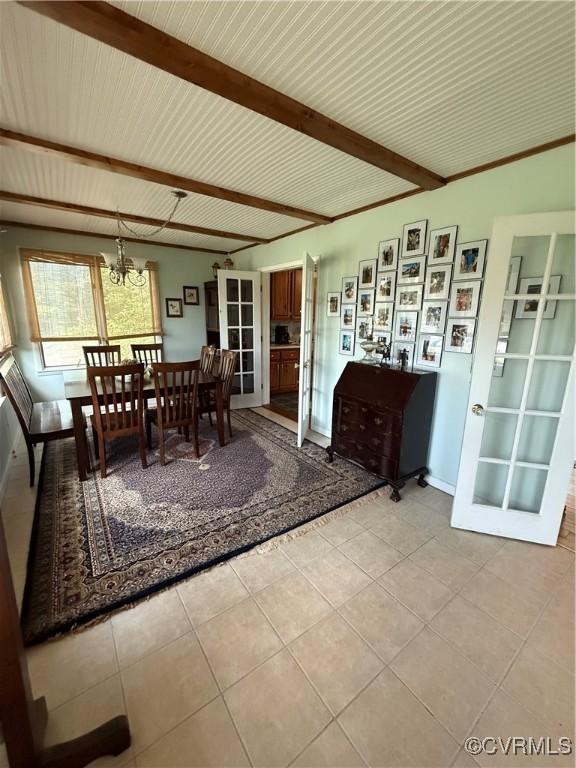 1686 Locust Grove Rd, Topping, VA 23169 - dining room with light tile patterned flooring, beam ceiling, baseboards, and a chandelier