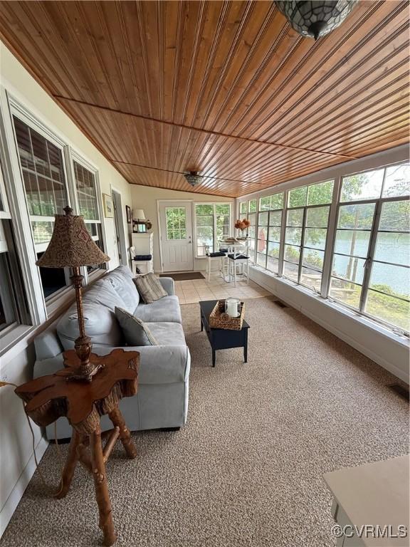 1686 Locust Grove Rd, Topping, VA 23169 - sunroom / solarium with wood ceiling and carpet flooring