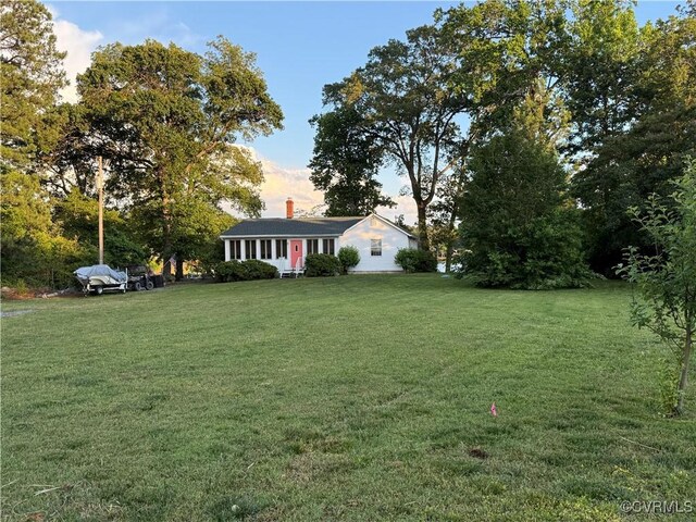 1686 Locust Grove Rd, Topping, VA 23169 - view of front facade with a front lawn and a chimney