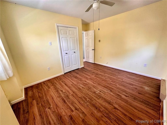 402 N Ivy Ave, Highland Springs, VA 23075 - unfurnished bedroom with wood finished floors, baseboards, and ceiling fan