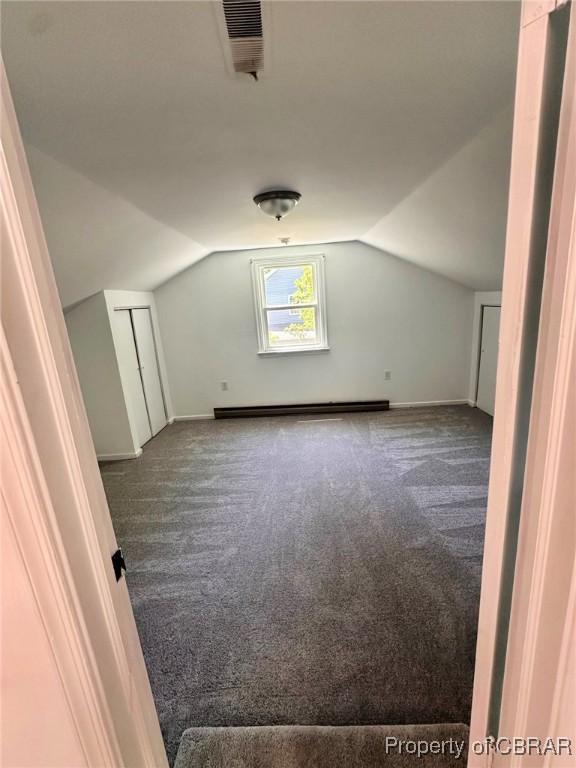 402 N Ivy Ave, Highland Springs, VA 23075 - bonus room with carpet, lofted ceiling, baseboards, and baseboard heating
