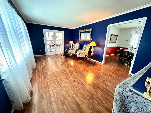 402 N Ivy Ave, Highland Springs, VA 23075 - sitting room featuring wood finished floors, baseboards, crown molding, and a chandelier