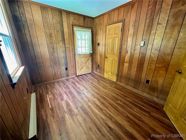 402 N Ivy Ave, Highland Springs, VA 23075 - foyer entrance featuring wooden walls, wood finished floors, and baseboards